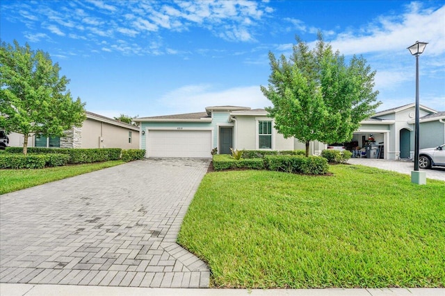 single story home with a front lawn and a garage