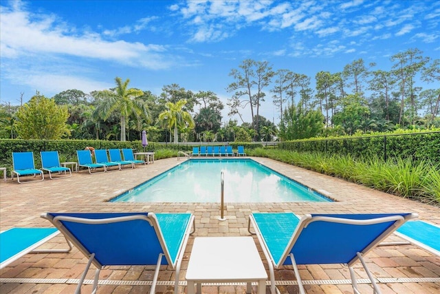 view of swimming pool with a patio