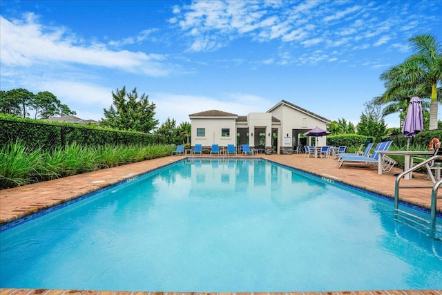 view of pool featuring a patio area