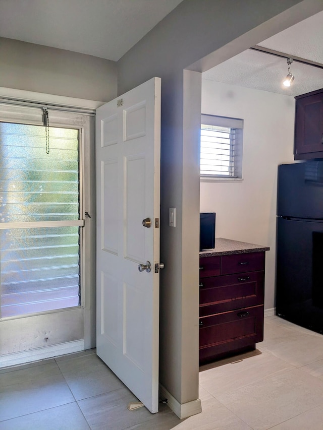 interior space featuring light tile patterned flooring