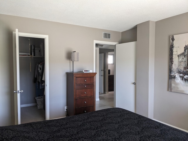 unfurnished bedroom featuring a closet and a textured ceiling