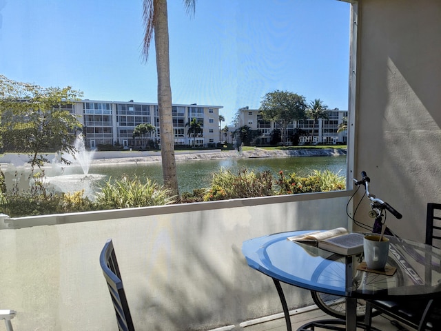 balcony featuring a water view