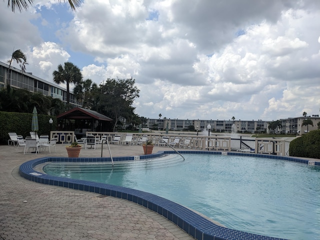 view of swimming pool featuring a patio