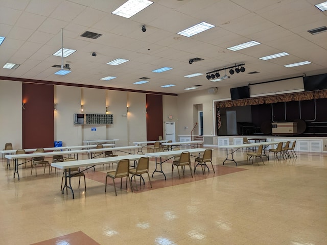 dining space with a paneled ceiling