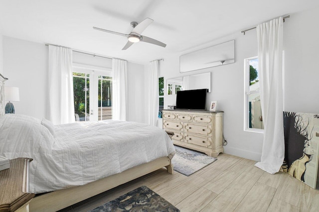 bedroom with ceiling fan, access to outside, and light hardwood / wood-style flooring