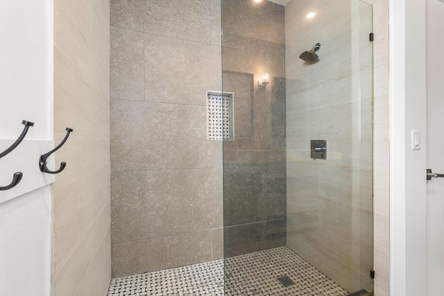 bathroom with tiled shower