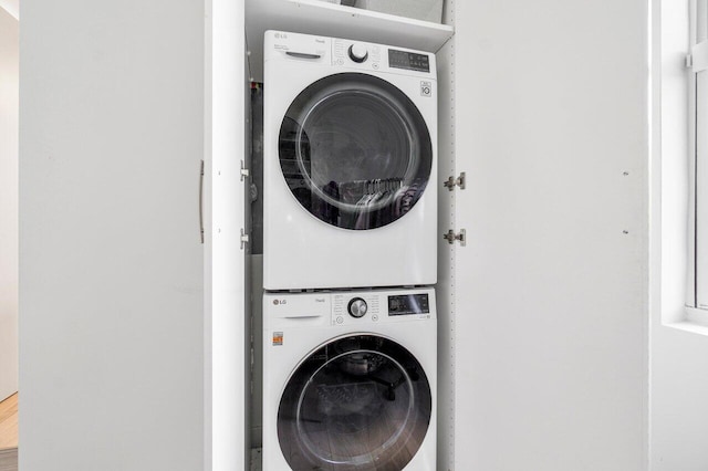 washroom with stacked washer / drying machine