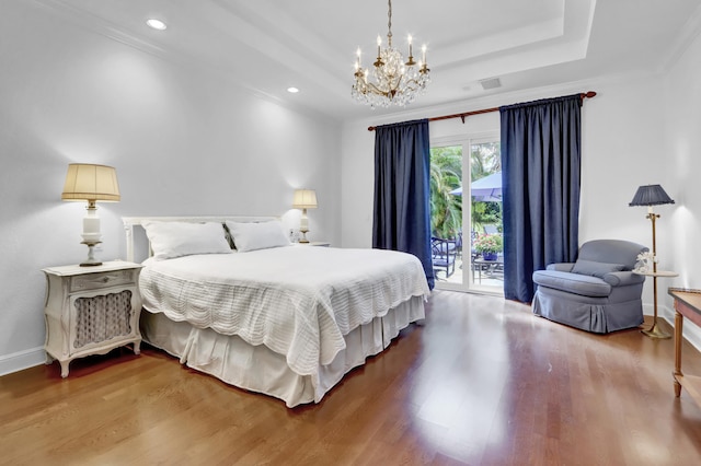 bedroom with access to exterior, hardwood / wood-style flooring, an inviting chandelier, and ornamental molding