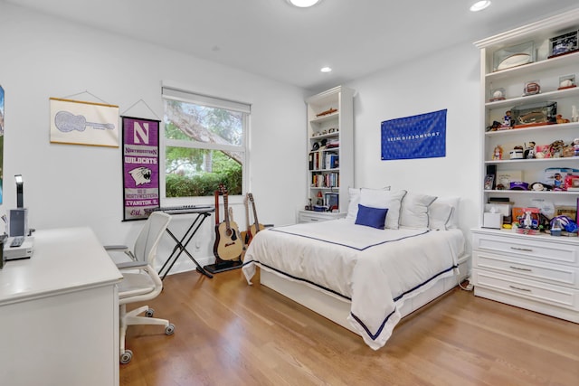 bedroom with light hardwood / wood-style floors