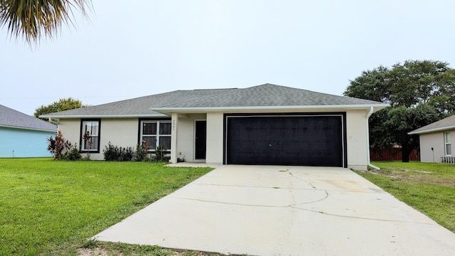 ranch-style home with a garage and a front lawn