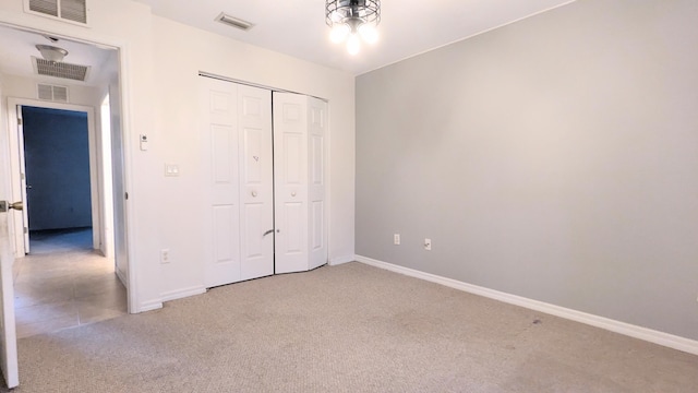 unfurnished bedroom with carpet and a closet