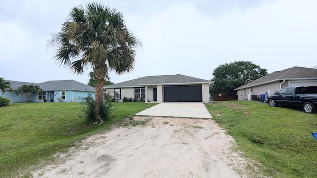 ranch-style home with a garage and a front lawn