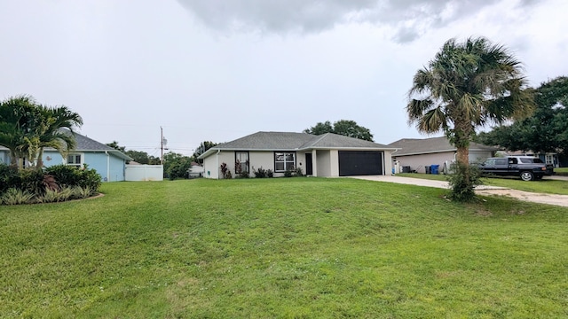 single story home featuring a garage and a front lawn