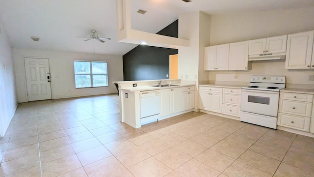 kitchen with light tile patterned floors, kitchen peninsula, white appliances, and white cabinetry