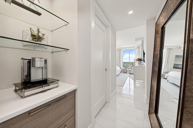 hallway with light tile patterned flooring