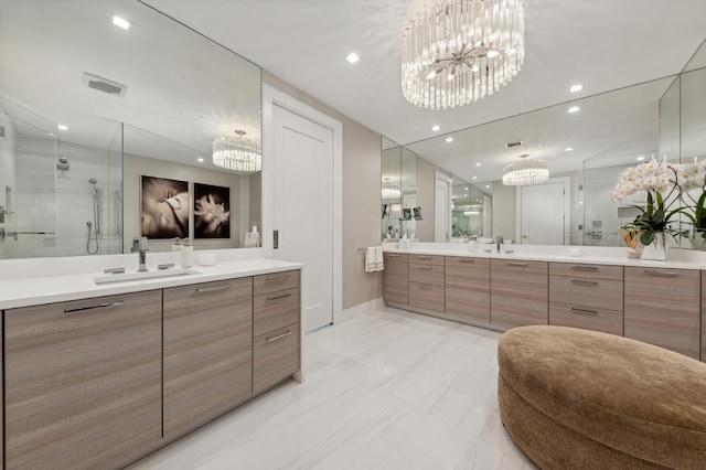 bathroom with walk in shower and vanity