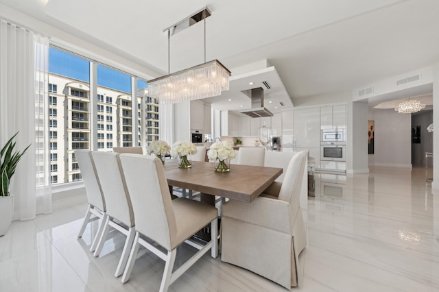 dining space featuring a chandelier