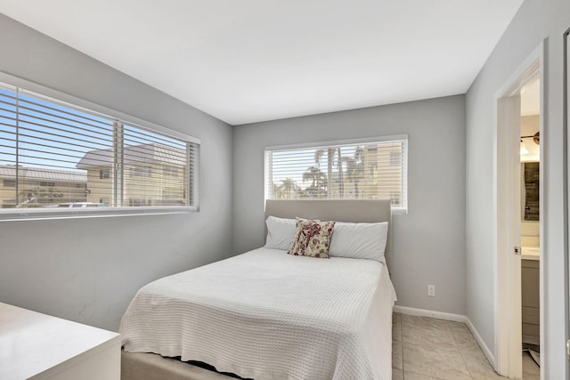 tiled bedroom with connected bathroom