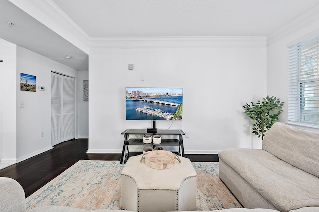 living room with ornamental molding and dark hardwood / wood-style floors