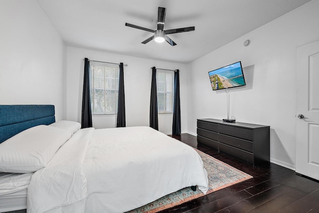 bedroom featuring ceiling fan and dark hardwood / wood-style floors