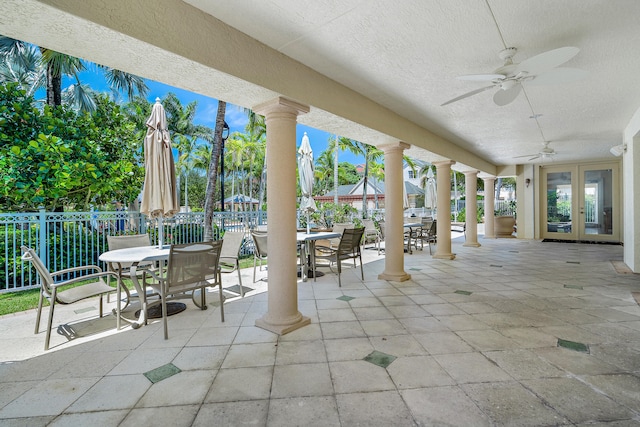 view of patio featuring french doors and ceiling fan