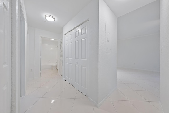 hallway with light tile patterned floors