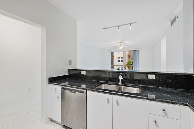 kitchen with white cabinetry, sink, dark stone counters, and dishwasher