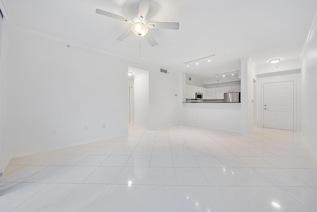 unfurnished living room featuring light tile patterned floors, crown molding, rail lighting, and ceiling fan