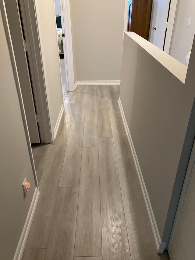 hallway featuring light hardwood / wood-style flooring