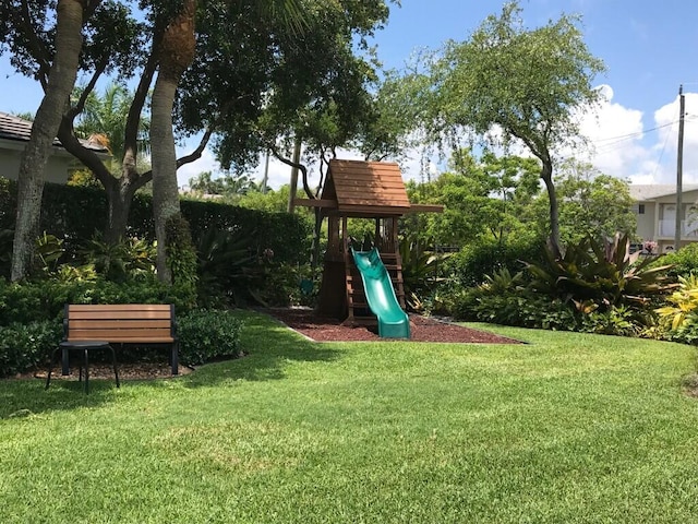 view of playground featuring a lawn