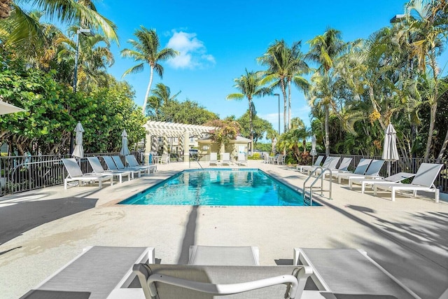 view of swimming pool with a pergola and a patio