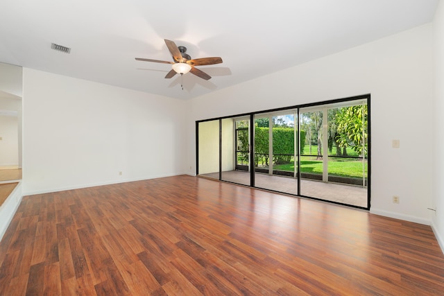 empty room featuring dark hardwood / wood-style floors and ceiling fan