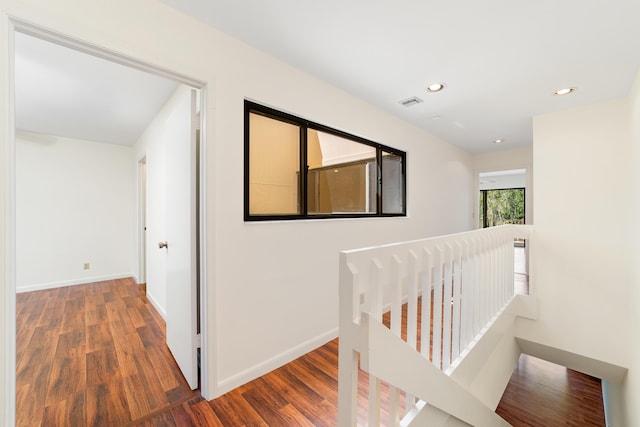 hall with dark hardwood / wood-style floors