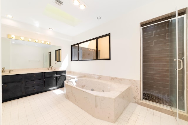 bathroom featuring tile patterned flooring, vanity, and separate shower and tub