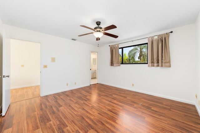 empty room featuring ceiling fan and wood-type flooring