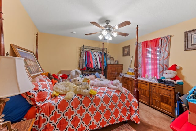 bedroom featuring ceiling fan and light carpet