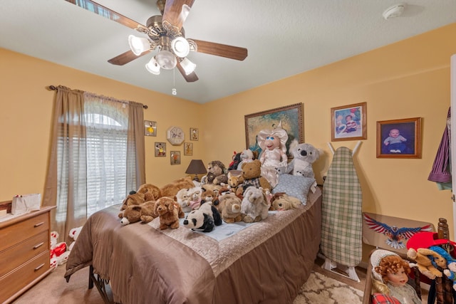 bedroom featuring ceiling fan and light colored carpet