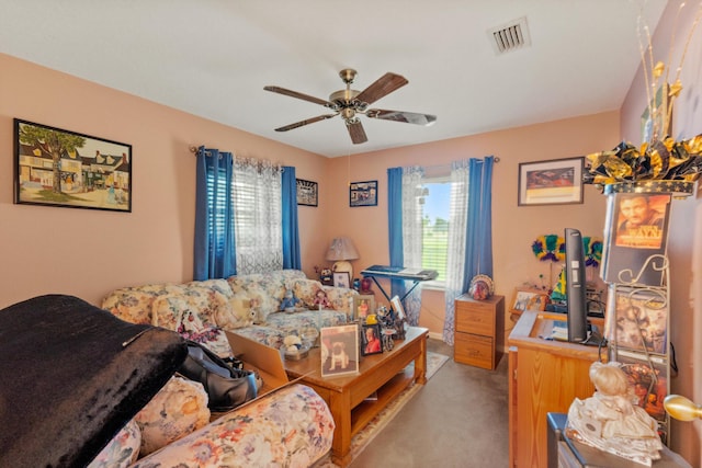 carpeted living room featuring ceiling fan and a healthy amount of sunlight