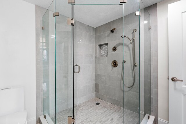 laundry area with light tile patterned flooring and washer and clothes dryer