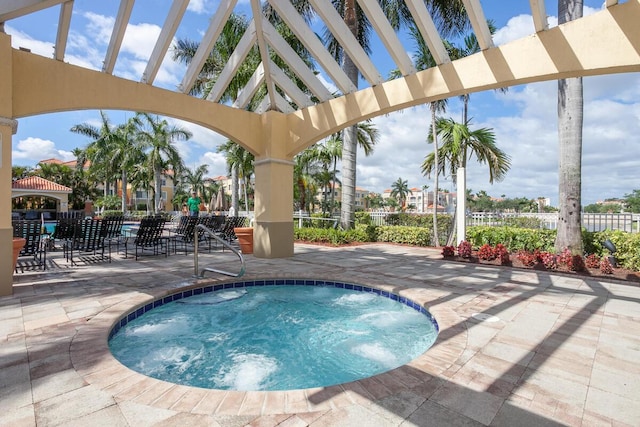 view of pool featuring a hot tub and a patio