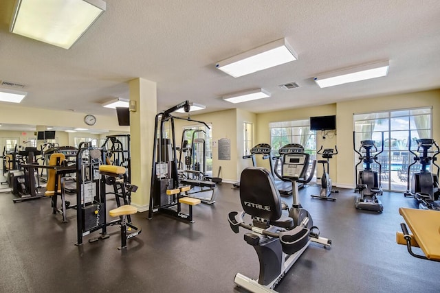 gym with a textured ceiling