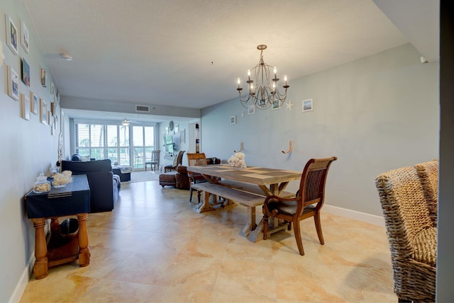 dining space with a chandelier