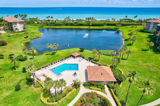 birds eye view of property with a water view