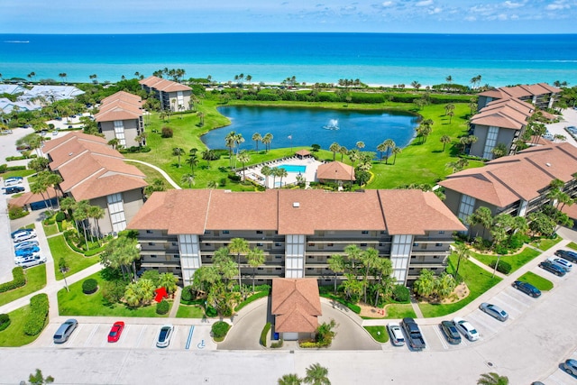 birds eye view of property featuring a water view