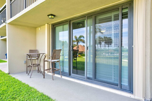 doorway to property featuring a balcony