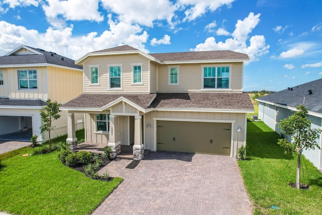 view of front facade featuring a garage and a front lawn