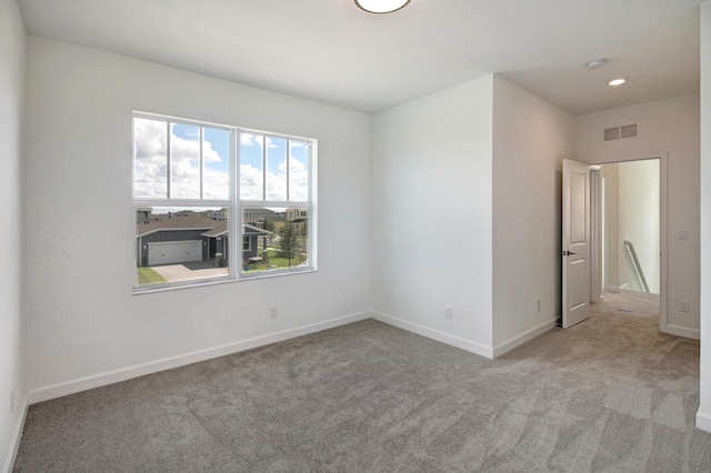 empty room with light colored carpet