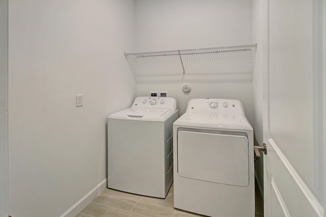 laundry area with washing machine and dryer