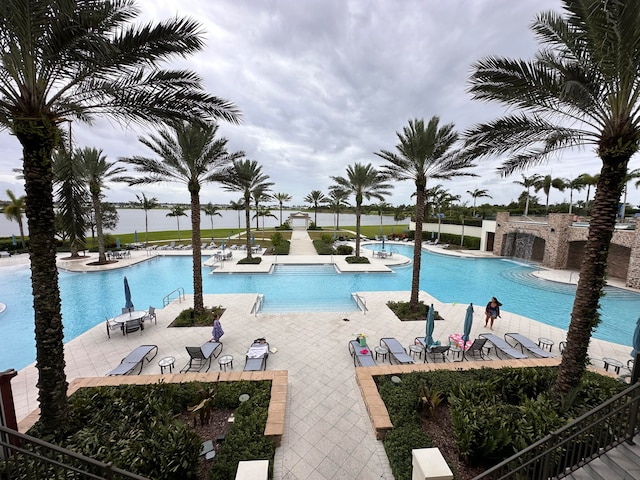 view of pool with pool water feature and a patio area