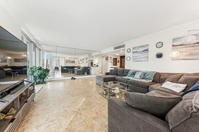 living room featuring crown molding